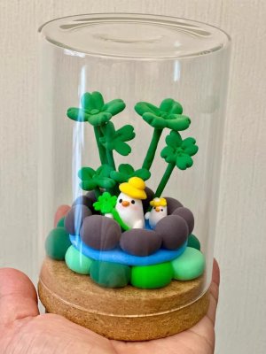 Two Adorable Clay Ducks Under a Glass Dome