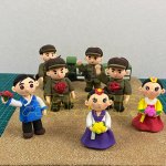 Colorful Clay Figurines with Flowers