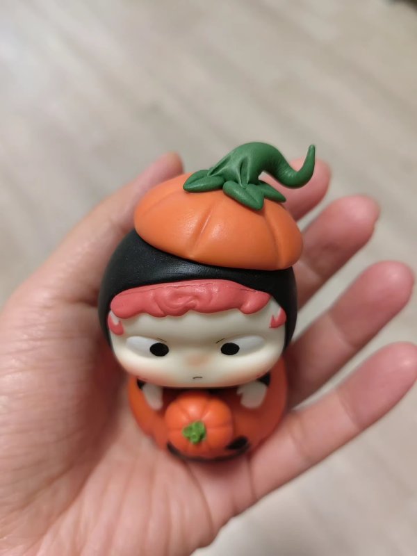 Cute Clay Figure with Pumpkin Elements