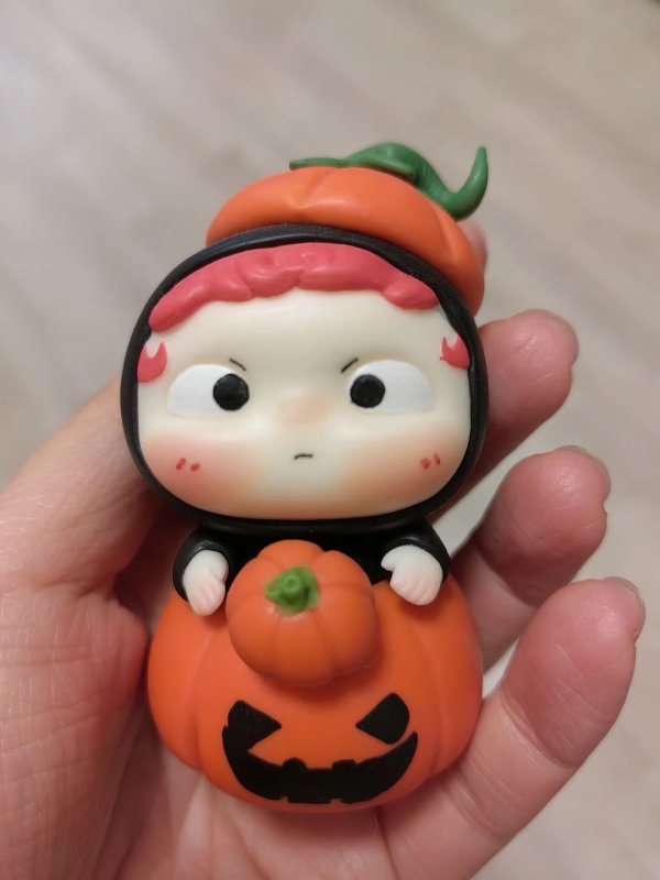 Cute Clay Figure with Pumpkin Elements