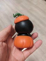 Cute Clay Figure with Pumpkin Elements