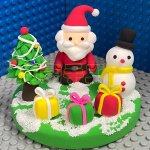 Festive Clay Santa and Snowman Scene