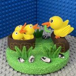 Playful Clay Ducklings with Nest