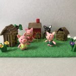 Playful Clay Pig Figures with Farmhouse