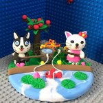 Whimsical Clay Cat and Dog Pond Scene