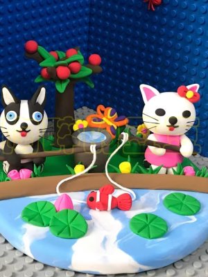 Whimsical Clay Cat and Dog Pond Scene