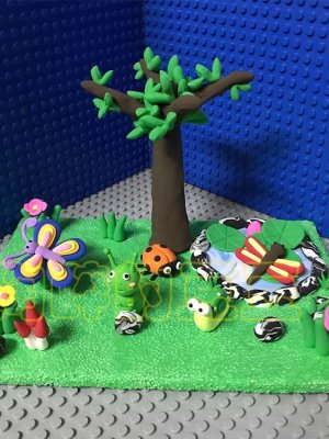 Whimsical Clay Garden Scene with Creatures